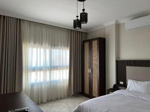 Postel nebo postele na pokoji v ubytování فندق لؤلؤة سينا