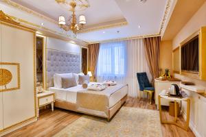 Postel nebo postele na pokoji v ubytování Emirhan Palace Hotel + 37 fotografií