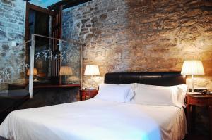 Cama o camas de una habitación en Hotel Rural Nobles de Navarra