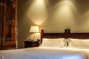 Cama o camas de una habitación en Hotel Rural Nobles de Navarra