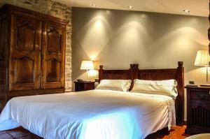 Cama o camas de una habitación en Hotel Rural Nobles de Navarra