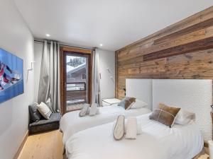 Posteľ alebo postele v izbe v ubytovaní Duplex avec espace détente, piscine et 4 chambres à Megève - FR-1-569-66
