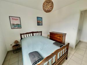 Posteľ alebo postele v izbe v ubytovaní Appartement spacieux avec balcon - à 50m de la plage