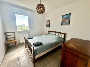 Posteľ alebo postele v izbe v ubytovaní Appartement spacieux avec balcon - à 50m de la plage
