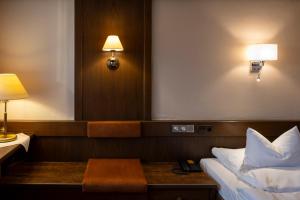 Postel nebo postele na pokoji v ubytování Steinbach-Hotel