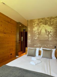 Rúm í herbergi á Hotel Žabljak