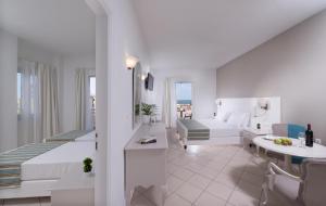 Postel nebo postele na pokoji v ubytování Dore Boutique Hotel