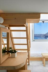 a tiny house with a view of the ocean at Santorini View in Akrotiri