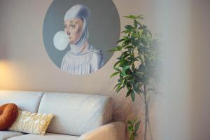 a painting of a painting of a nun in a living room at LeonArt Living 34 in Graz