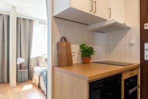 Kuchyň nebo kuchyňský kout v ubytování Finest Apartments - Studio Kołobrzeska + 7 fotografií