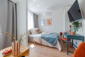 Postel nebo postele na pokoji v ubytování Finest Apartments - Studio Kołobrzeska