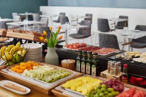 a buffet with different types of food on a table at Axel Hotel San Sebastián - Adults Only in Donostia-San Sebastián