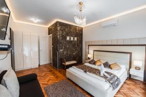 Postel nebo postele na pokoji v ubytování Melior Szálló