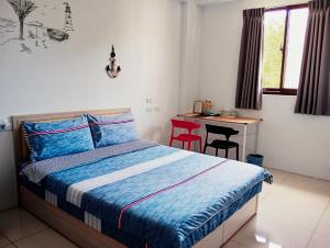 Postel nebo postele na pokoji v ubytování Yu Hai B&B