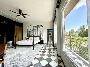 a bedroom with a bed and a large window at Helene's House - 5 Bedrooms Villa in Jl Bisma, Central Ubud in Ubud