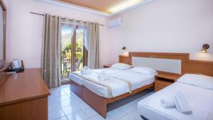 Postel nebo postele na pokoji v ubytování Castello Rosso Hotel