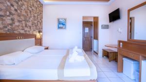 Postel nebo postele na pokoji v ubytování Castello Rosso Hotel