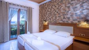 Postel nebo postele na pokoji v ubytování Castello Rosso Hotel