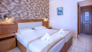 Postel nebo postele na pokoji v ubytování Castello Rosso Hotel