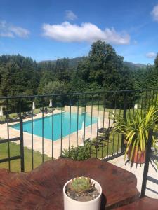 a view of a swimming pool from a balcony at Quinta de Barbêdo - Turismo Rural in Caniçada