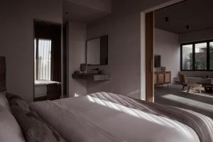 A bed or beds in a room at Casa Cook El Gouna - Adults Only
