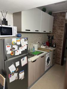 A kitchen or kitchenette at Donna Margherita Appartamento