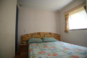 Letto o letti in una camera di Camping Vigna di Valle