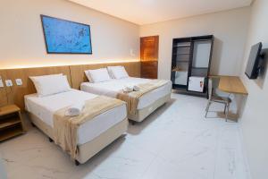 Postel nebo postele na pokoji v ubytování Arrey Express Hotel - Piracuruca