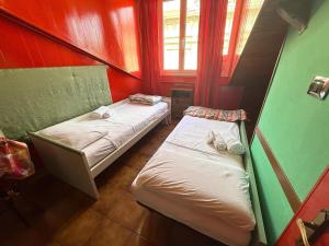 Ένα ή περισσότερα κρεβάτια σε δωμάτιο στο Suite Garibaldi - Sanremo