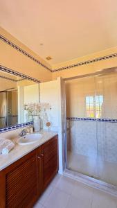 a bathroom with a shower and a sink at Quinta da Atela in Alpiarça +42 photos