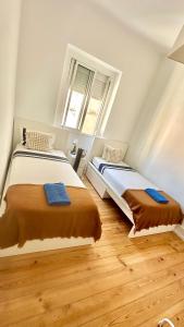 Ένα ή περισσότερα κρεβάτια σε δωμάτιο στο Guest rooms lisbon