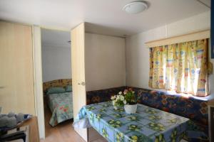 Säng eller sängar i ett rum på Camping Vigna di Valle