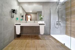 a bathroom with a sink and a shower at Maspalomas Villas by Dunas - Adults Only in Maspalomas +46 photos