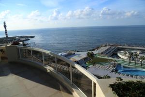 a view of the ocean from the balcony of a resort at Lahoya Suites in Beirut