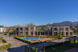 a house with a swimming pool in front of it at Wabi-Sabi - 2br Private Villa in Batumi