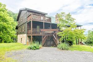 a large house with a staircase leading up to it at Change of Attitude By Avada Properties in Sevierville