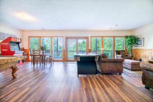 a large living room with a pool table in it at Change of Attitude By Avada Properties in Sevierville