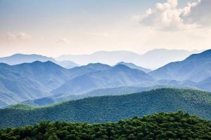 a view of a mountain range with trees and mountains at Change of Attitude By Avada Properties in Sevierville