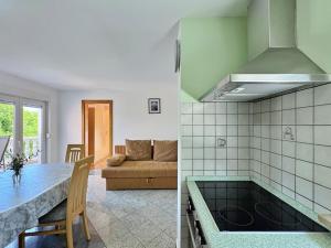 two views of a kitchen and a living room at Apartments Vodopija in Soline