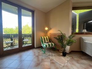 TV a/nebo společenská místnost v ubytování Csopak Strand Apartman + 8 fotografií