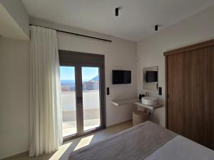 Postel nebo postele na pokoji v ubytování Casa Notos