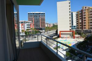 a balcony with a view of a city at Alba Suites in Vlorë