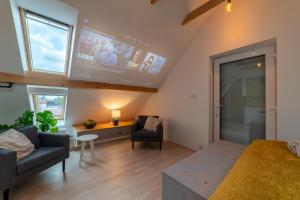 TV a/nebo společenská místnost v ubytování TinyGreens B & B