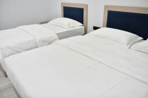 Postel nebo postele na pokoji v ubytování QUT Hotel