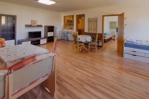 a room with two beds and a kitchen and a living room at Monteurwohnungen - Hagemann Querfurter Str 4 in Lutherstadt Eisleben