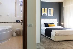 Postel nebo postele na pokoji v ubytování Orhideea Residence & Spa