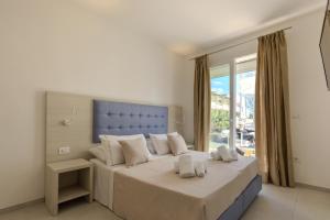 Postel nebo postele na pokoji v ubytování Scirocco Boutique Eco Hotel