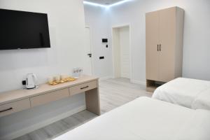 Postel nebo postele na pokoji v ubytování QUT Hotel