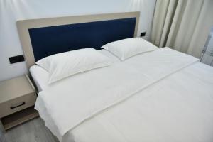 Postel nebo postele na pokoji v ubytování QUT Hotel