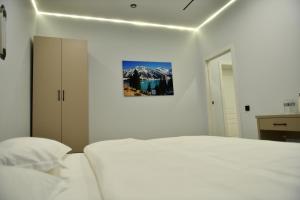 Postel nebo postele na pokoji v ubytování QUT Hotel